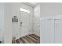 Bright foyer with hardwood floors, offering a welcoming entrance into the home at 637 Hilchot Dr, Summerville, SC 29486
