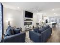 Inviting living room with modern fireplace, stylish furnishings, and abundant natural light at 861 Recess Point Dr, Moncks Corner, SC 29461