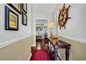 Elegant entryway with hardwood floors, decorative accents, and views into the living area at 864 Club Cottage Rd, Edisto Beach, SC 29438