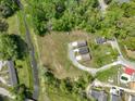 An aerial shot showcases three homes with lush green surroundings, offering serene privacy at 0 James Bell Dr, North Charleston, SC 29406