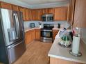 Well-lit kitchen equipped with stainless steel appliances and ample cabinet space at 104 Queen Mary Ct, Summerville, SC 29485
