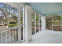 Large screened in porch with natural light and outdoor views at 109 Gerideau St, Walterboro, SC 29488