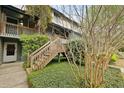 The home's exterior features a wooden staircase, greenery, and well-maintained landscaping at 1120 Hidden Cove Dr # I, Mount Pleasant, SC 29464