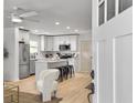 Modern kitchen featuring stainless steel appliances, a central island, and a view from the front door at 1133 Mount Batten Dr, Hanahan, SC 29410