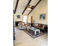 Cozy living room boasts beamed vaulted ceiling, fireplace and plenty of natural light at 1291 Old Colony Rd, Mount Pleasant, SC 29464