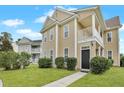 Attractive two-story home with a welcoming entrance, lush landscaping, and a bright facade at 154 Old Jackson Rd, Goose Creek, SC 29445