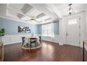 Dining room boasts coffered ceilings, wainscoting, hardwood floors, and natural light at 158 Netherfield Dr, Summerville, SC 29486