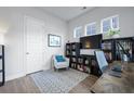 Cozy office space with built-in bookshelves, a comfortable chair, and natural light from multiple windows at 183 Country Gate Lane Ln, Summerville, SC 29485