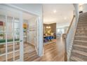 Inviting foyer showcasing hardwood floors and an open floor plan to the dining area at 185 Red Bluff St, Summerville, SC 29483
