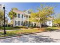 Inviting two-story home with a spacious front yard and a charming porch at 1870 Carolina Bay Dr, Charleston, SC 29414