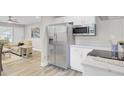 Modern kitchen with stainless steel appliances and white cabinets at 2916 Louise Dr, North Charleston, SC 29405