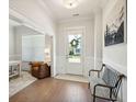 Inviting foyer with hardwood floors, a bench, and view of a living space filled with natural light at 2951 Clearwater Dr, Mount Pleasant, SC 29466