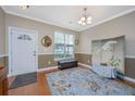 Inviting foyer features a stylish rug, elegant decor, and plenty of natural light streaming through the window at 2952 Sweetleaf Ln, Johns Island, SC 29455