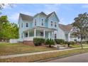 Beautiful two-story home with a classic design, neat lawn, and inviting curb appeal at 412 Hydrangea St, Summerville, SC 29483