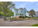 Attractive two-story house featuring a welcoming front porch and a well-maintained lawn at 412 Hydrangea St, Summerville, SC 29483