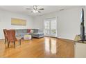 Inviting living room featuring hardwood floors and lots of natural light at 4512 Great Oak Dr, North Charleston, SC 29418