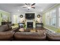 Comfortable living room with a fireplace, hardwood floors, and a cozy atmosphere at 5509 Alpine Dr, Summerville, SC 29483