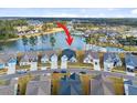 An aerial view of the home featuring a tranquil lake, neighborhood, and nearby pool at 552 Marsh Cv Cir, Summerville, SC 29486