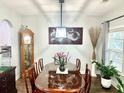 Traditional dining room boasts a grand clock, decorative art, and a large dining table at 565 Mountain Laurel Cir, Goose Creek, SC 29445