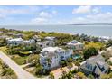 Beautiful white home with a pool, close to the beach and ocean views at 904 Middle St, Sullivans Island, SC 29482