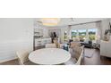 Open floor plan with dining area seamlessly flows into the modern kitchen at 1027 Swamp Rose Run, Summerville, SC 29485