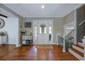 Inviting foyer with hardwood floors, white trim, and a decorative console table at 1342 Dennis Blvd, Moncks Corner, SC 29461