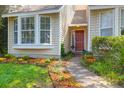 Inviting front entrance with a decorative door and lush landscaping along the walkway at 14 Town Park Ln # B, Charleston, SC 29412