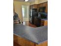 A kitchen with stainless steel appliances, and blue countertops at 1561 Montclair St, Charleston, SC 29407
