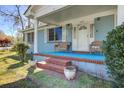 Cozy front porch with seating and brick steps leading to the entrance at 1925 Belgrade Ave, Charleston, SC 29407