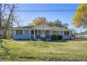 Quaint single-story home with a welcoming front porch and green lawn at 1925 Belgrade Ave, Charleston, SC 29407