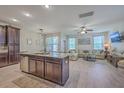 Open-concept living space featuring a kitchen island and spacious living room with large sectional at 2001 Poplar Grove Pl, Summerville, SC 29483