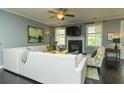 Comfortable living room featuring a fireplace, large sofa, and ample natural light at 2160 Pentland Dr, Charleston, SC 29412