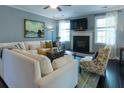 Cozy living room with fireplace, plush white sofa, and neutral decor at 2160 Pentland Dr, Charleston, SC 29412