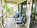 Inviting balcony with rocking chairs, a small table, and a relaxing outdoor view at 229 Linkside Villas # 1/3 Share, Edisto Beach, SC 29438