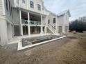 Backyard showcasing a modern pool design with clean lines, awaiting water and landscaping at 2870 Ion Ave, Sullivans Island, SC 29482