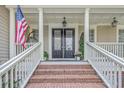 Inviting front entrance with brick steps, white columns, and classic double doors at 3805 Adrian Way, Mount Pleasant, SC 29466