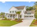 Beautiful two-story home with a well-maintained lawn, driveway, and attached two car garage at 3873 Newhall St, Mount Pleasant, SC 29466
