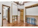 Hallway with wood floors and trim features multiple doorways to other rooms in the house at 394 Shoofly Rd, Ridgeville, SC 29472