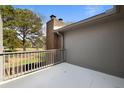 Spacious balcony overlooking a well-maintained yard with mature trees at 404 Ventura Pl, Mount Pleasant, SC 29464