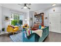 Bright living room featuring hardwood floors, large window, comfortable seating, and stylish furnishings at 45 Sycamore Ave # 116, Charleston, SC 29407