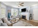 Inviting living room with a fireplace, stylish decor, and comfortable seating arrangement at 45 Sycamore Ave # 536, Charleston, SC 29407