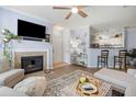 Spacious living room featuring a cozy fireplace, open layout, and modern furnishings at 45 Sycamore Ave # 536, Charleston, SC 29407
