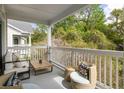Relaxing outdoor patio with comfortable seating and a beautiful view of lush greenery at 45 Sycamore Ave # 536, Charleston, SC 29407