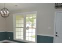 Dining room with large window for natural light and stylish two-tone walls at 708 Old State Rd, Goose Creek, SC 29445