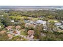 Panoramic aerial view of the home with surrounding trees, golf course, and community amenities at 816 Club Cottage Rd, Edisto Beach, SC 29438