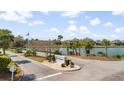 Scenic community entrance with Wyndham sign, flags, mature landscaping, and views of the water at 816 Club Cottage Rd, Edisto Beach, SC 29438
