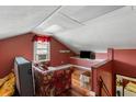 Upstairs attic featuring hardwood floors, a cozy seating area and natural light at 1144 Island View Dr, Mount Pleasant, SC 29464