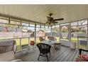 Relaxing screened-in porch with comfortable seating, perfect for enjoying the outdoors at 1144 Island View Dr, Mount Pleasant, SC 29464