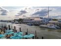 Scenic aerial view of a waterfront restaurant with boats docked along the harbor and outdoor seating at 1416 Dahlia Dr, Mount Pleasant, SC 29464