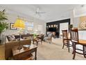 Comfortable living room with neutral carpet, elegant furnishings, and contemporary lighting at 1597 Cambridge Lakes Dr # 303E, Mount Pleasant, SC 29464
